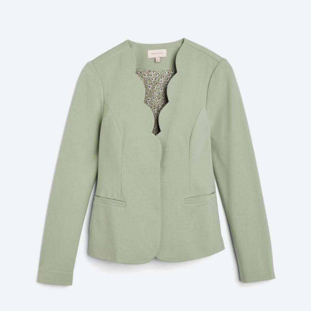 Skies are blue, green blazer.